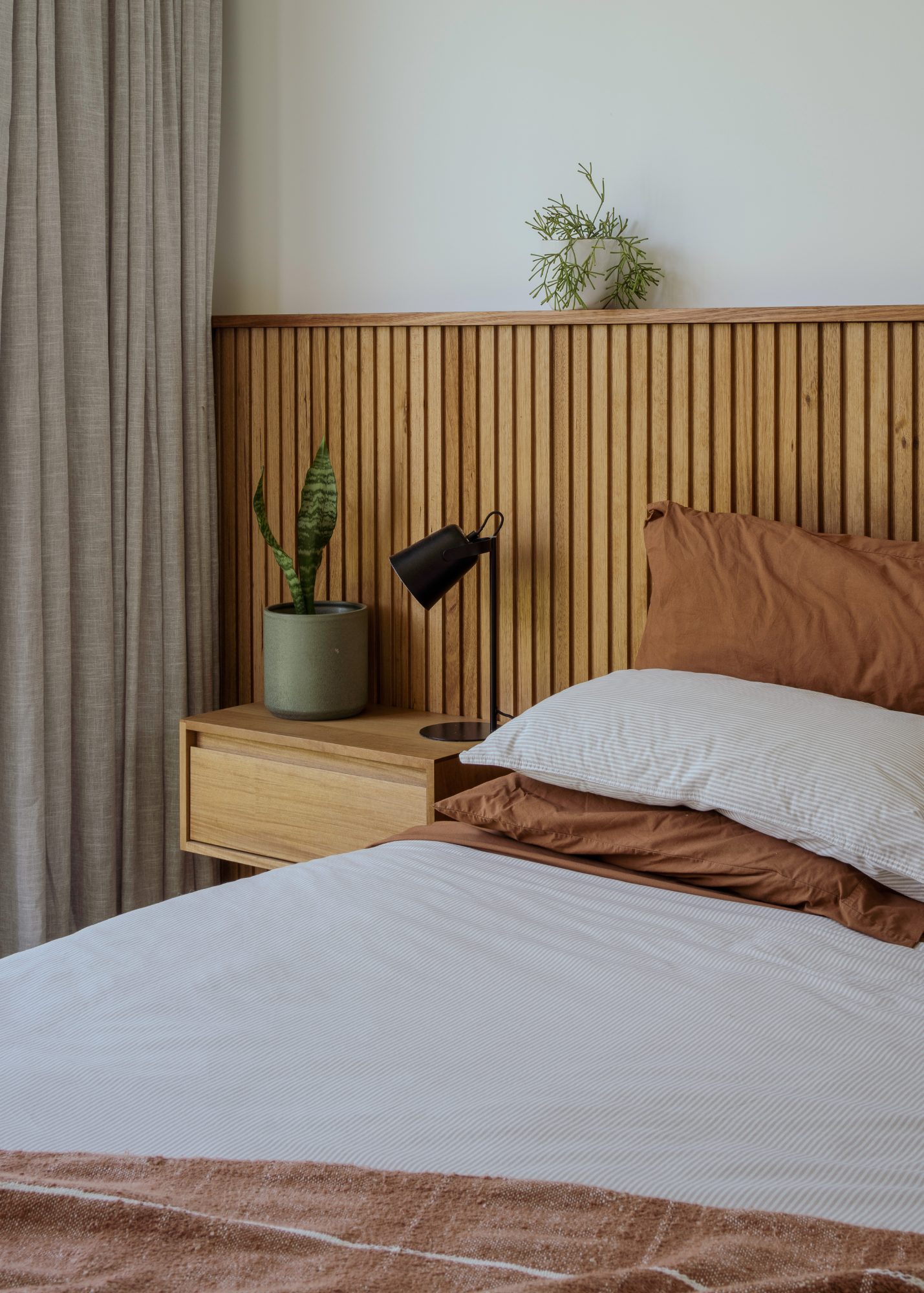 Awa Coastal bed and battened timber headboard, Whangapoua interior photography NZ