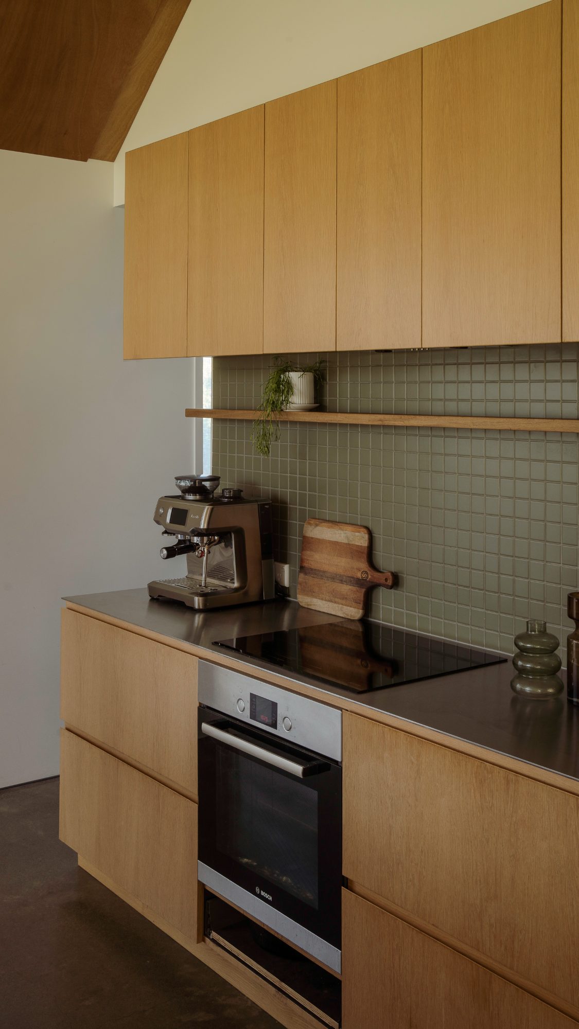 Awa Coastal oak kitchen with green mosaic splashback, Whangapoua interior photography NZ
