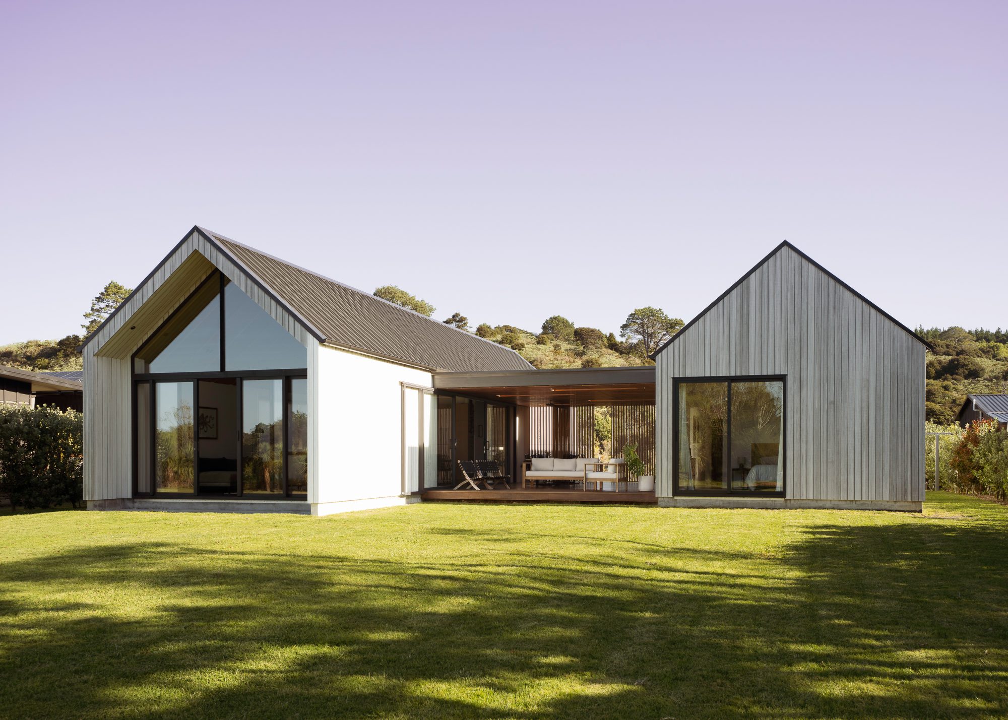 Awa Coastal gabled timber home and courtyard,  New Zealand architectural photography
