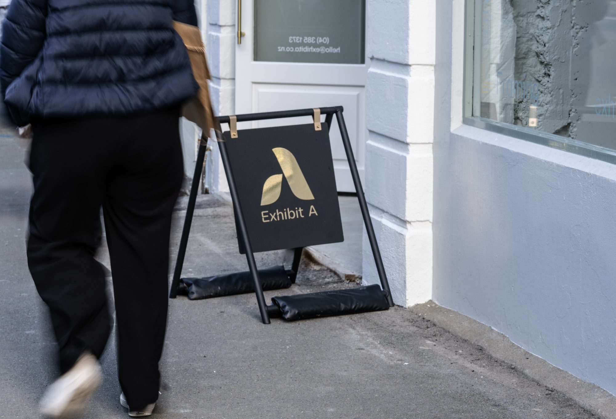 Exhibit A sandwich board signage on Wellington street, commercial photography NZ