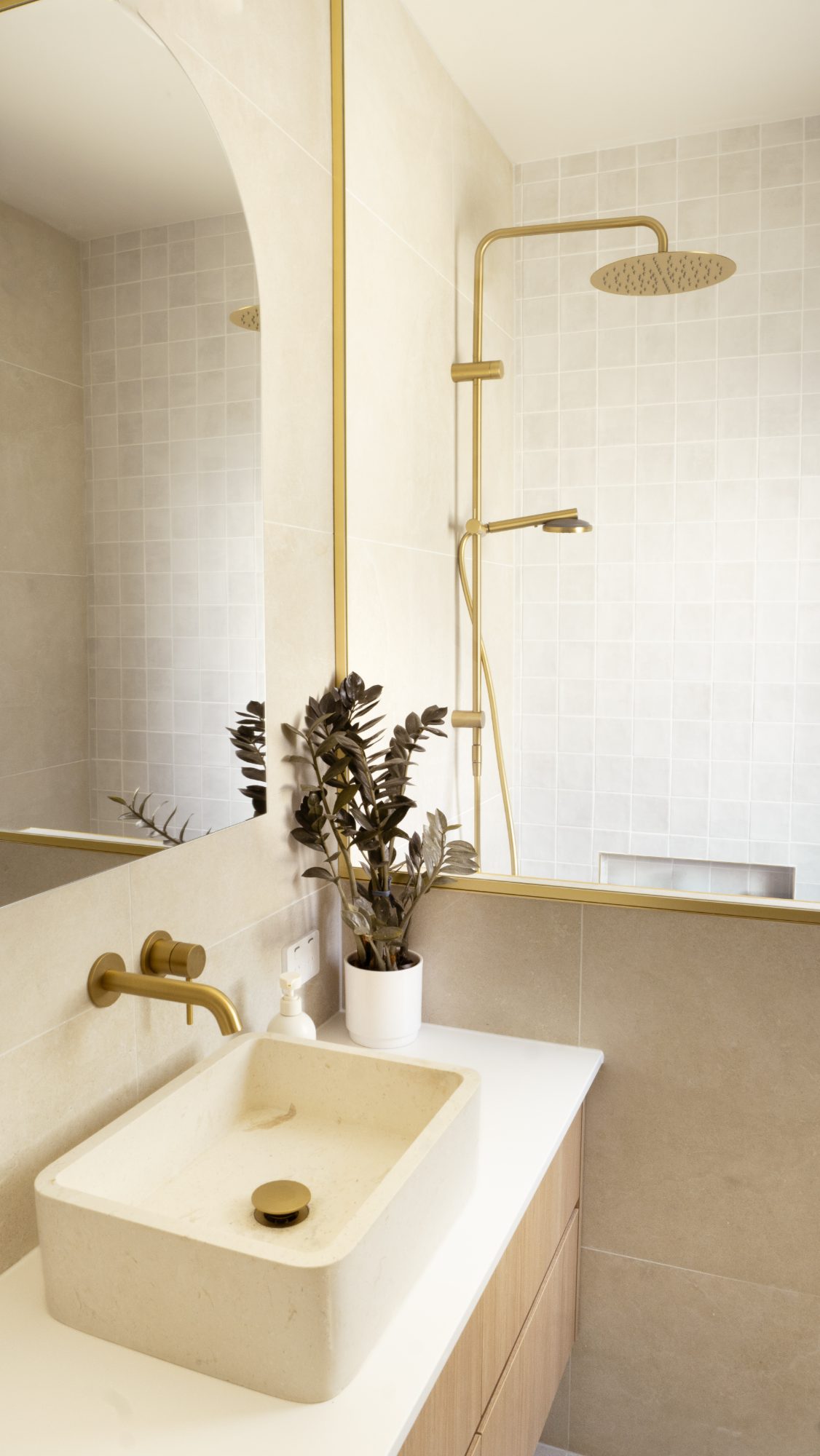 Frame House bathroom overview with natural stone, Wellington interior photography NZ