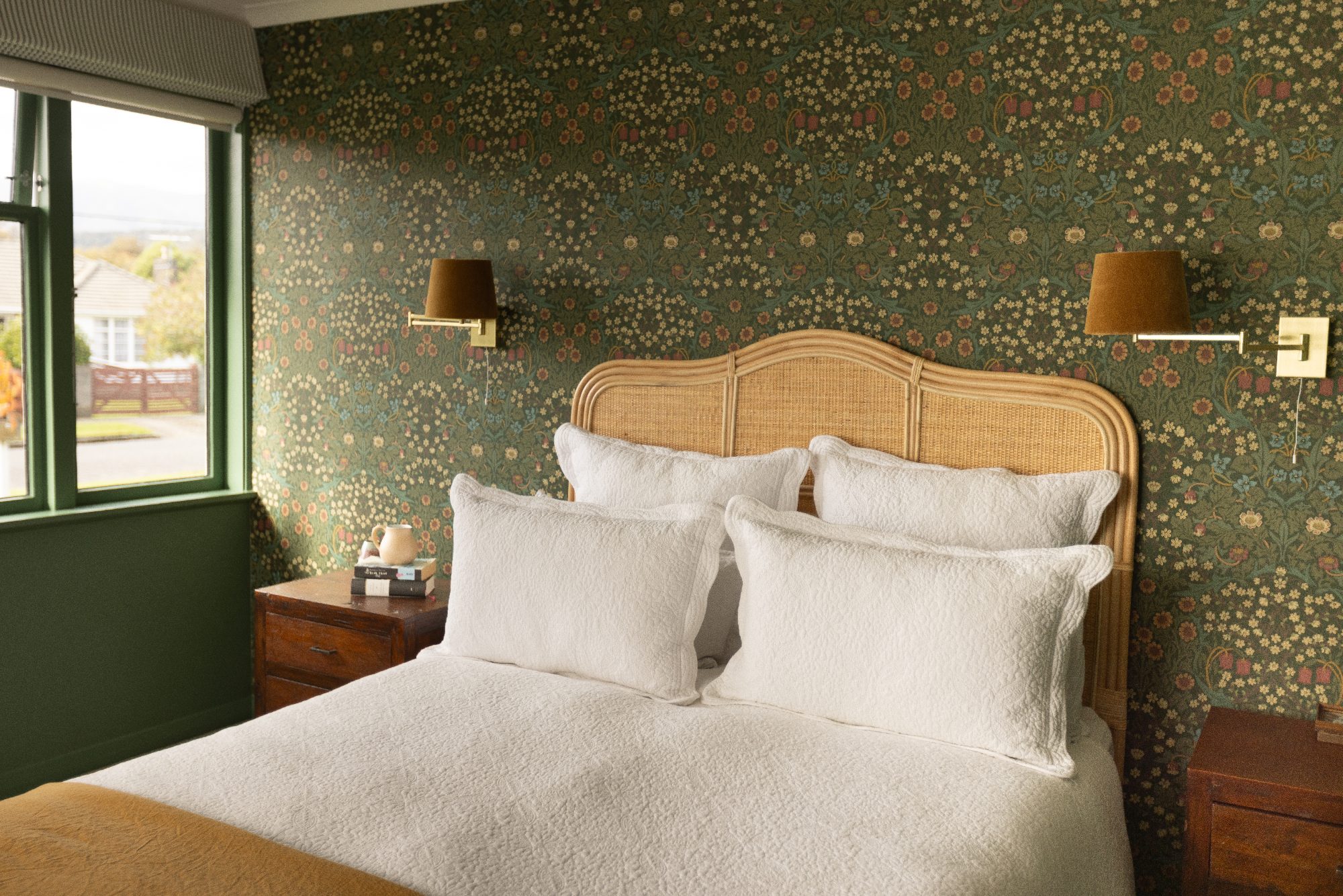 Mabel House green bedroom with rattan headboard, Wellington interior photography NZ