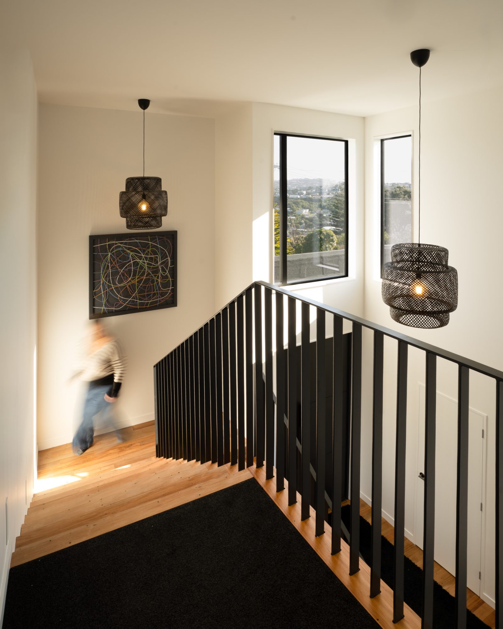 Seatoun Heights freestanding bath framed by harbour window, Wellington interior photography NZ