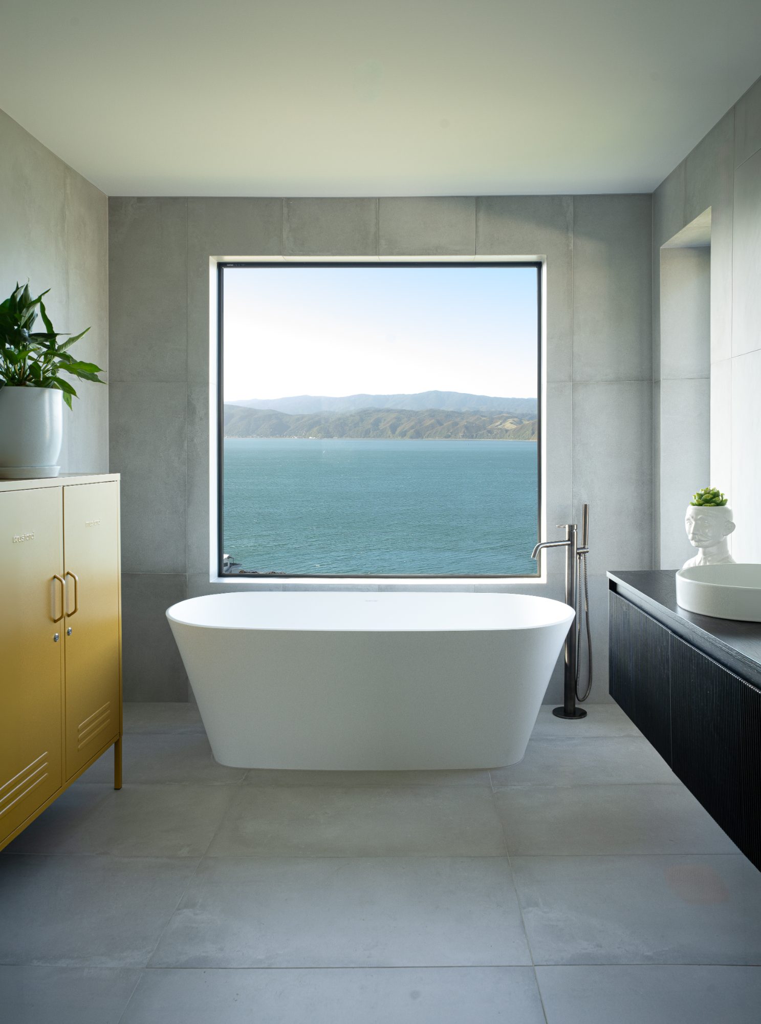 Seatoun Heights bedroom corner chair with coastal view, Wellington interior photography NZ
