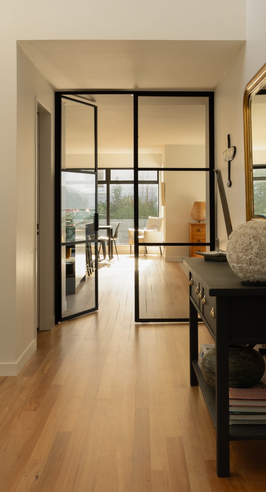 Seatoun Heights entry hall with steel doors and gold mirror, Wellington interior photography NZ