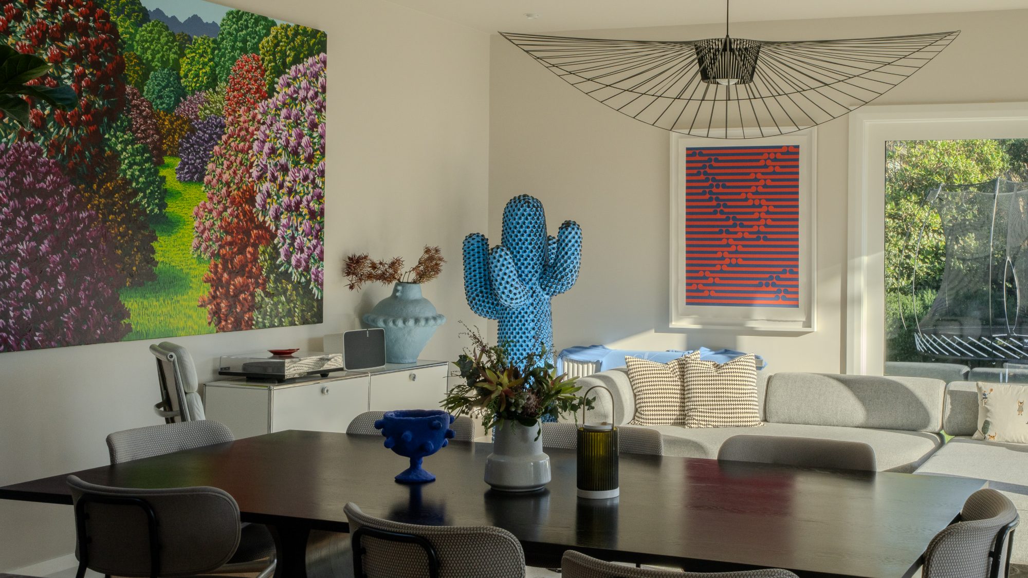 Seatoun House dining and living area with blue cactus sculpture, Wellington interior photography NZ
