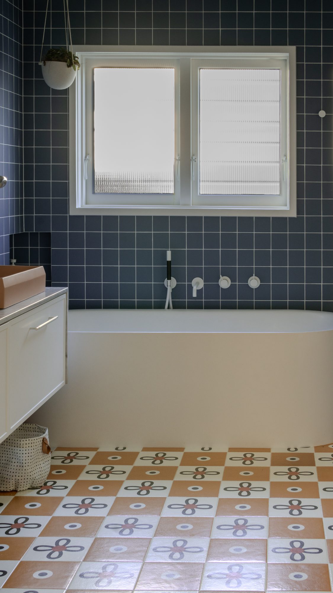 Seatoun House bathroom with navy tile and patterned floor, Wellington interior photography NZ
