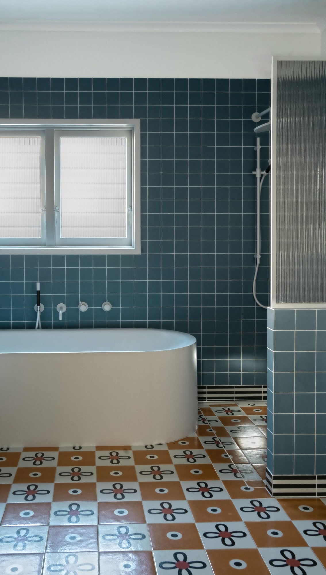 Seatoun House teal tiled bathroom with freestanding bath, Wellington interior photography NZ