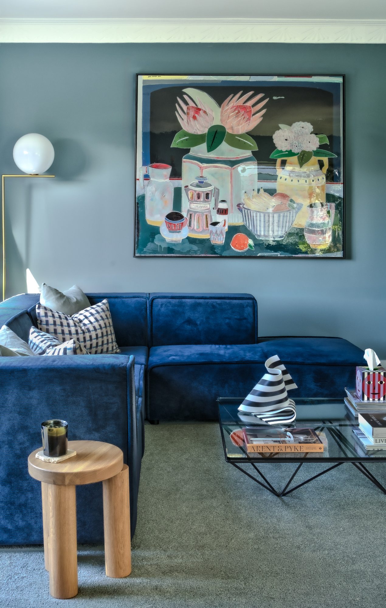 Seatoun House living room with blue sofa and oak side table, Wellington interior photography NZ