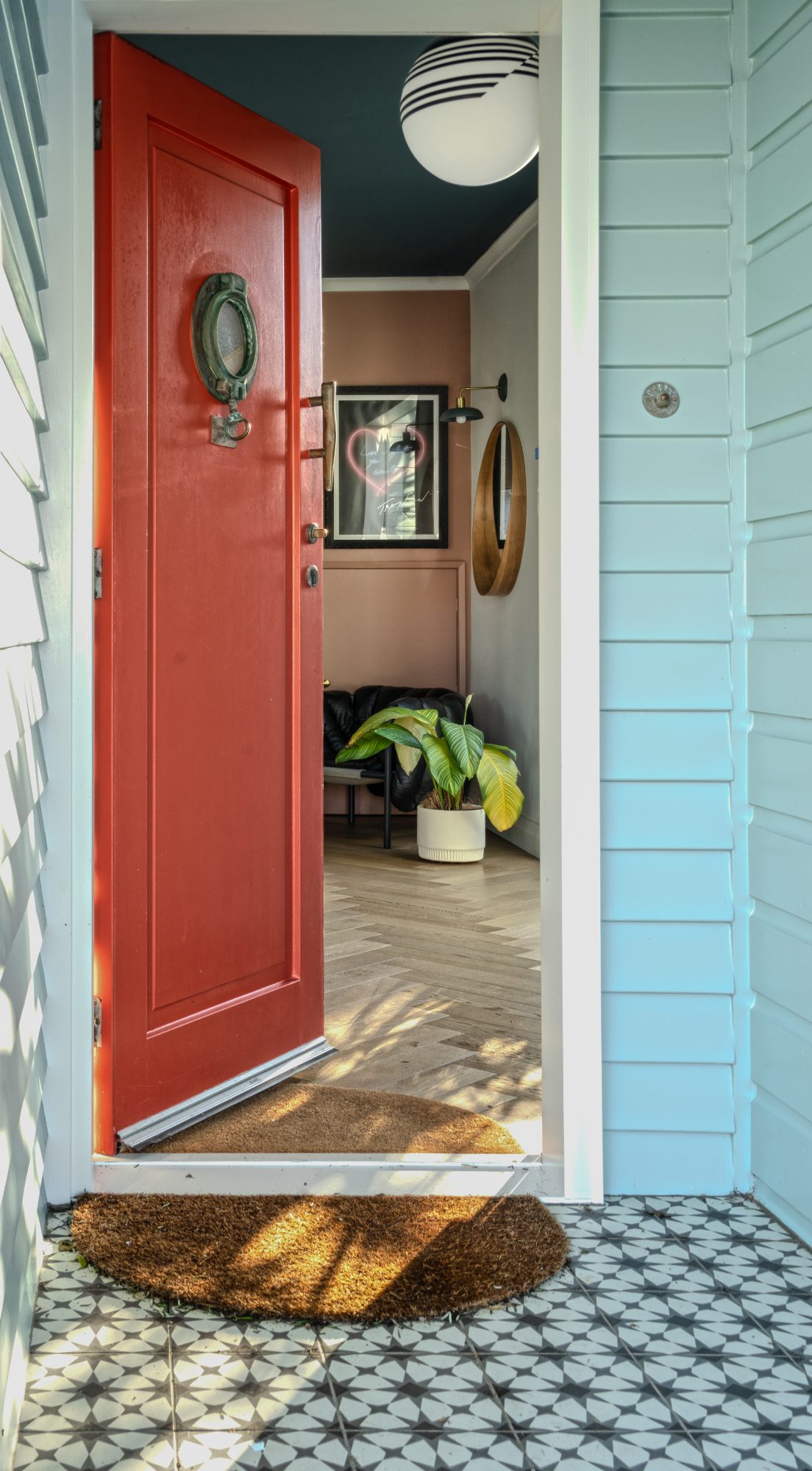Seatoun House red front door and patterned porch tile, Wellington interior photography NZ