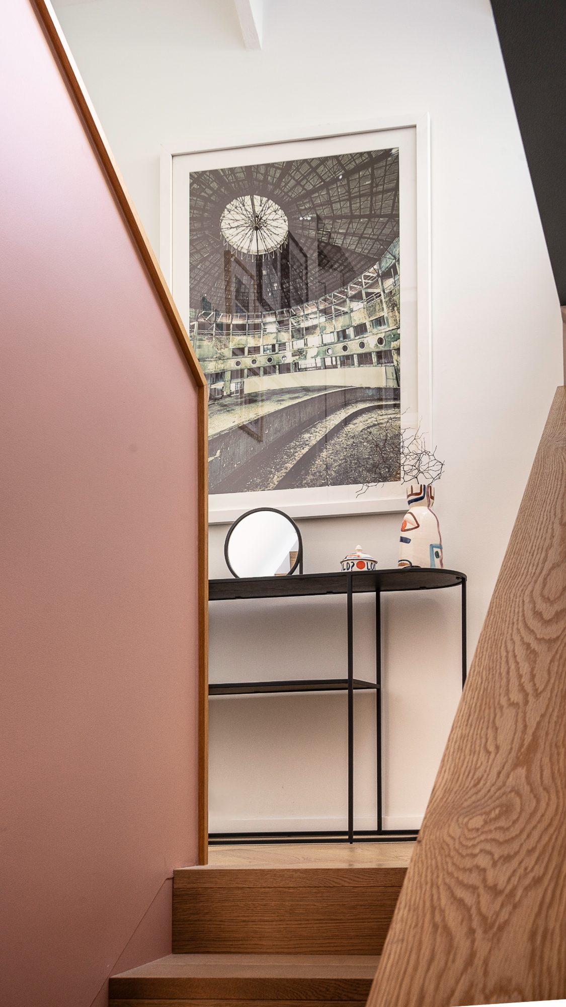 Seatoun House stairwell with framed artwork and console, Wellington interior photography NZ